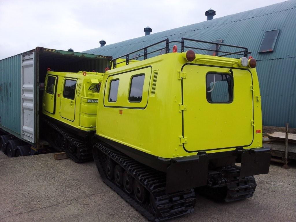 Shipping container being loaded with a BV206